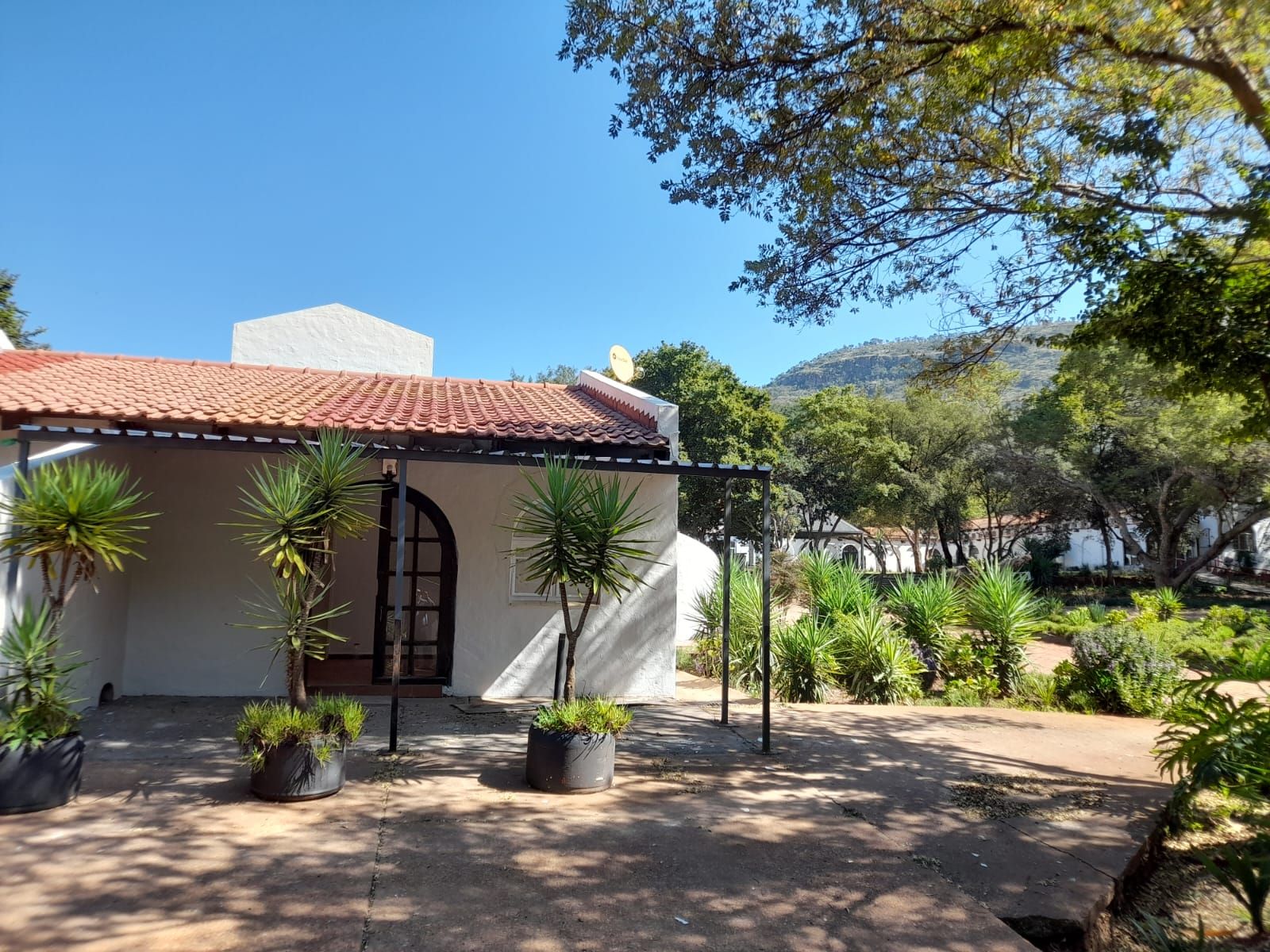 The arched entrance of a building at Aloe Valley